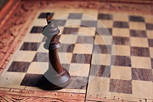 Traditional Balinese wooden chess pieces on wood carved chess board