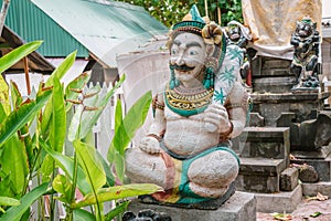 Traditional Balinesian guard statue usually placed at entry points to private or public places. Two blurred guard statues