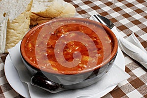 Traditional Balkan pasulj bean soup with bread photo
