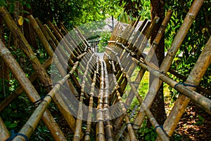 Traditional bamboo bridge to be crossed by the visitors to enter deviate Culture Village. Sarawak, Malaysia