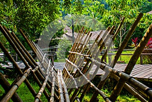 Traditional bamboo bridge to be crossed by the visitors to enter deviate Culture Village. Sarawak, Malaysia