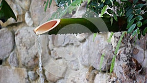 Traditional bamboo fountain with zen stones, japanese bamboo fountain