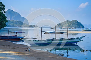 Traditional banca boat at sandy Corong Beach in El Nido, Philippines