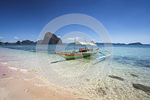 Traditional banca boats on beautiful Corong beach, El Nido . Palawan, Philippines. Summer exotic vacation and tourism