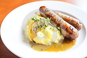 traditional bangers and mash with mustard on the side