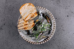 Traditional barbecue italian blue mussel with baguette