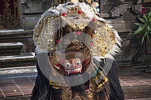 Traditional Barong dance with face mask and colourful dress to mimic hindu character from Ramayana during the morning in Bali