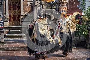 Traditional Barong dance with mask and colourful dress to mimic hindu character from Ramayana during the morning in Bali
