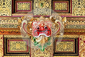 Traditional Barong mask pattern in temple on Bali island