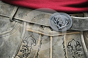 Traditional BAvarian Lederhose with metal buckle showing staghorn photo