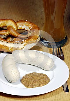 Traditional bavarian white sausage and bretzel photo