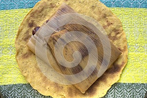 Traditional bean tamal on corn tortilla