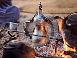 Traditional Bedouin coffee with spices on fire