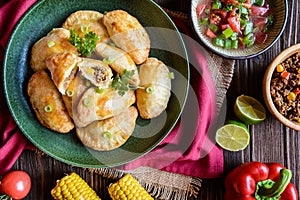 Traditional beef Empanadas with Aji Picante sauce photo