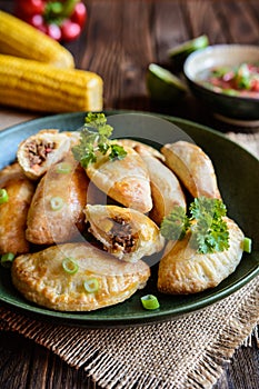 Traditional beef Empanadas with Aji Picante sauce photo