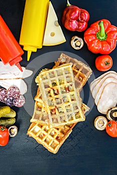 Traditional belgian waffles with cheese and vegetables. Copy space