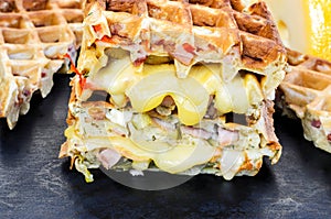 Traditional belgian waffles with cheese and vegetables. Copy space