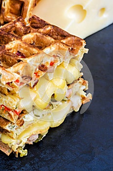 Traditional belgian waffles with cheese and vegetables. Copy space