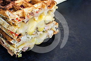 Traditional belgian waffles with cheese and vegetables. Copy space