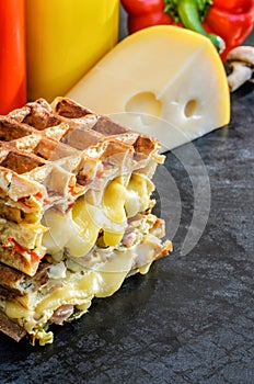 Traditional belgian waffles with cheese and vegetables. Copy space