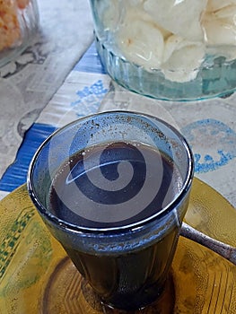 traditional black coffee and morning habbit from indonesia people photo