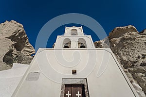 Traditional blue dome church and white bell tower in Santorini in Greece