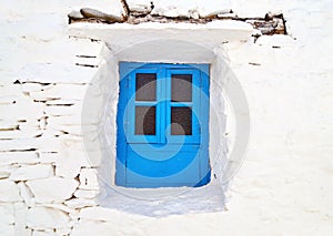 Traditional blue window at Sifnos island Greece