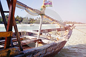 Traditional boat on beautiful beach and tropical sea at low tide in Jambiani, Zanzibar, Tanzania Africa