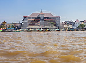 Traditional boat in the middle of Musi River, Palembang, Indonesia.