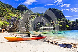 Traditional boats turquoise sea and rocks in El Nido,Palawan island,Philippines.