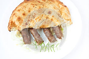 Traditional bosnian food cevapi with flat bread and onion photo