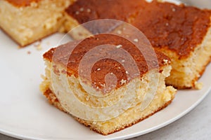 Traditional Brazilian dessert known as BOLO GELADO in Portuguese - Making step by step: Close-up of cake pieces photo