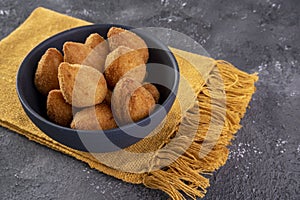 Traditional Brazilian fried snack stuffed with chicken . Coxinha de frango