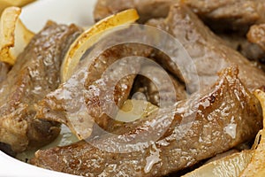 Traditional Brazilian pub food striploin with onions close