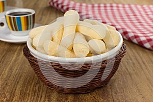 Traditional Brazilian starch biscuit called biscoito de polvilho in a basket in a wood background coffe table photo