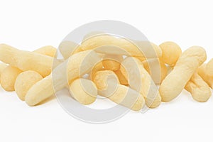 Traditional Brazilian starch biscuit called biscoito de polvilho isolated in white background photo