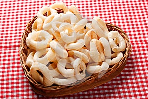 Traditional Brazilian starch biscuit, called polvilho biscuit in the basket photo
