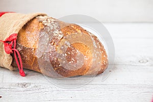 Traditional bread closeup detail with canvas bag