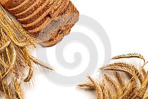 Traditional bread. Fresh loaf of rustic traditional bread with wheat grain ear or spike plant isolated on white