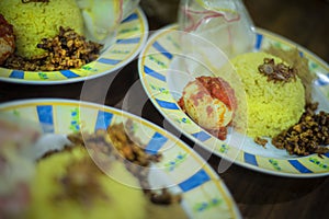 Traditional breakfast dish called `Nasi KUning` or yellow rice