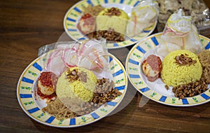 Traditional breakfast dish called `Nasi KUning` or yellow rice