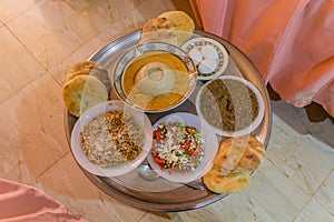 Traditional breakfast in Sudan - bread, Aseeda (boiled sorghum porridge) with a sauce