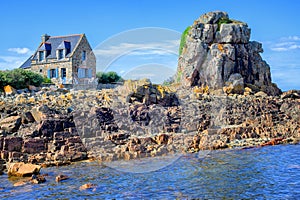 Traditional breton stone house and the rock, Brittany, France