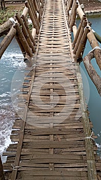 Traditional bridge made of bamboo in this morning photo in Subang, Indonesia