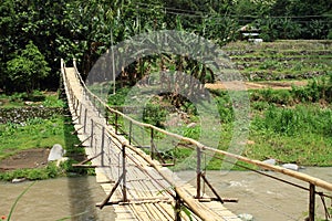 Traditional bridge over river photo