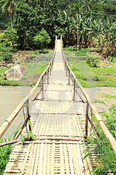 Traditional bridge over river photo