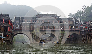 Traditional bridge on the Tuo Jiang river in Fenghuang, China