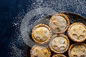 Traditional British Christmas Pastry Dessert Mince Pies with Apple Raisins Nuts Filling Golden Shortcrust Powdered Vintage Plate