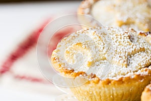 Traditional British Christmas Pastry Dessert Home Baked Mince Pies with Apple Raisins Nuts Filling on White Elegant Cake Stand.