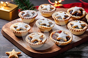 Traditional British Christmas Pastry Home Baked Mince Pies with Apple Raisins Nuts Filling on rustic wood table